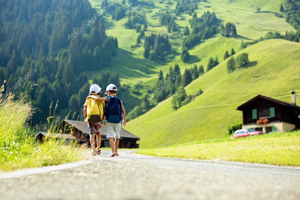 Two little children, boy brothers with backpacks travel on the r Stock ...