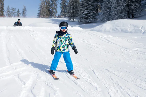 Cute little boy, skiing happily in Austrian ski resort in the mo — Stock Photo, Image