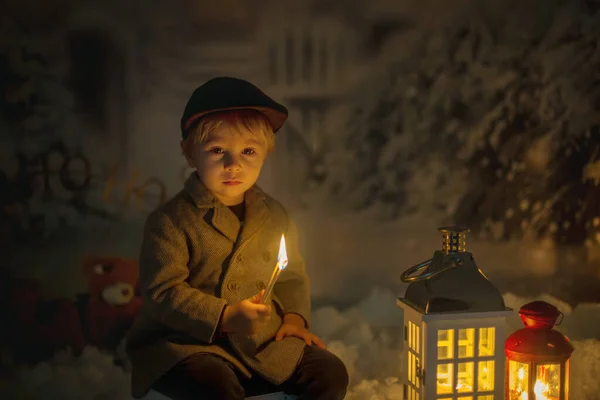 Little Boy Looking Flame Match Sitting Snow Outdoors — Stock Photo, Image