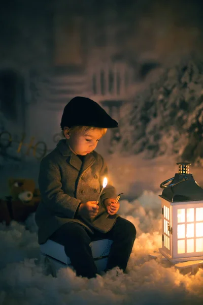 Little Boy Looking Flame Match Sitting Snow Outdoors — Stock Photo, Image