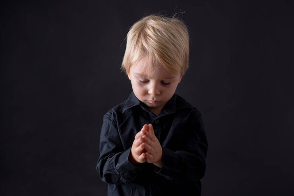 Little toddler child, boy praying, child praying, isolated background