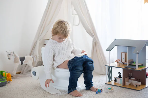 Cute Toddler Child Boy Sitting Baby Toilet Potty Playing Toys — Stock Photo, Image