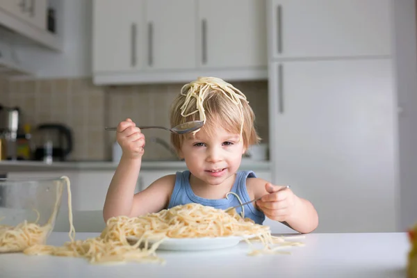 Little Blond Boy Toddler Child Eating Spaghetti Lunch Making Mess Stock Picture