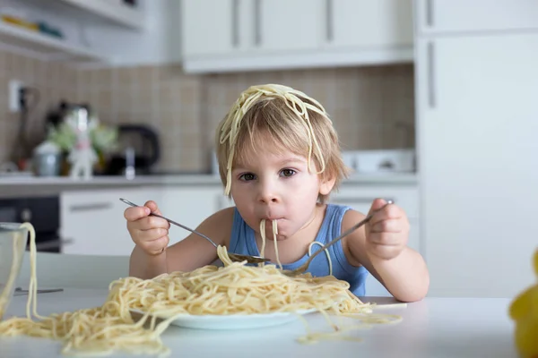 Little Blond Boy Toddler Child Eating Spaghetti Lunch Making Mess Royalty Free Stock Images