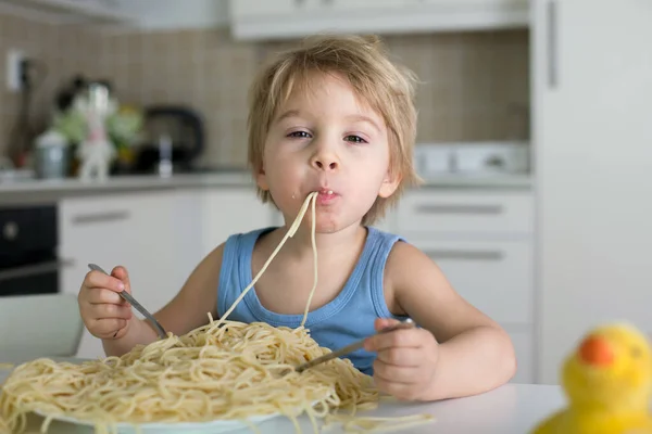 Little Blond Boy Toddler Child Eating Spaghetti Lunch Making Mess Stock Picture