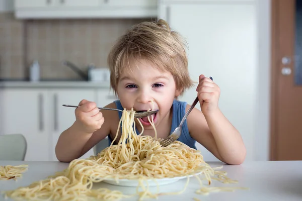 Little Blond Boy Toddler Child Eating Spaghetti Lunch Making Mess Royalty Free Stock Images