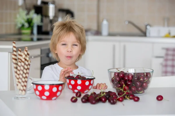 Cute Blond Child Toddler Boy Eating Cherries Home Having Fun — Stock Photo, Image