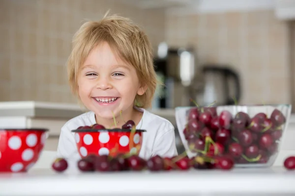 Cute Blond Child Toddler Boy Eating Cherries Home Having Fun — Stock Photo, Image