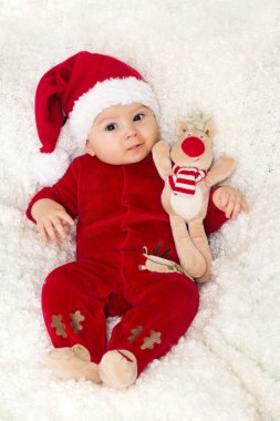 Küçük şirin bebek çocuk, giyinmiş kırmızı Noel Baba şapkası ile genel