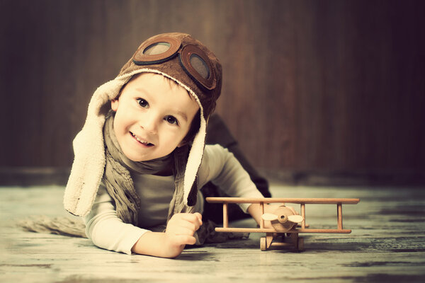 Young boy, playing with airplane