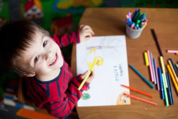 Adorable little boy, drawing picture for easter — Stock Photo, Image