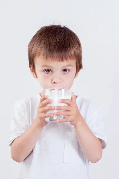 Cute little boy, drinking milk, holding glass of milk, mustaches — Stock Photo, Image