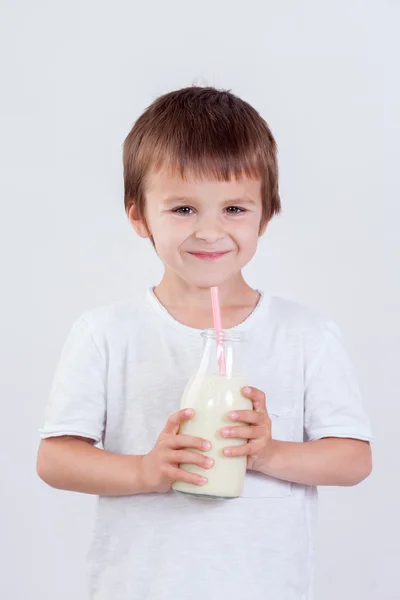 Cute little boy, drinking milk, holding glass of milk, mustaches — Stock Photo, Image