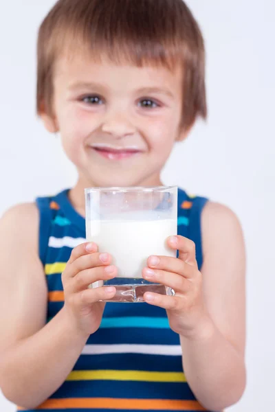 Cute little boy, drinking milk, holding glass of milk, mustaches — Stock Photo, Image