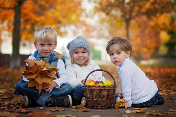 Three cute kids in the park, playing — 图库照片