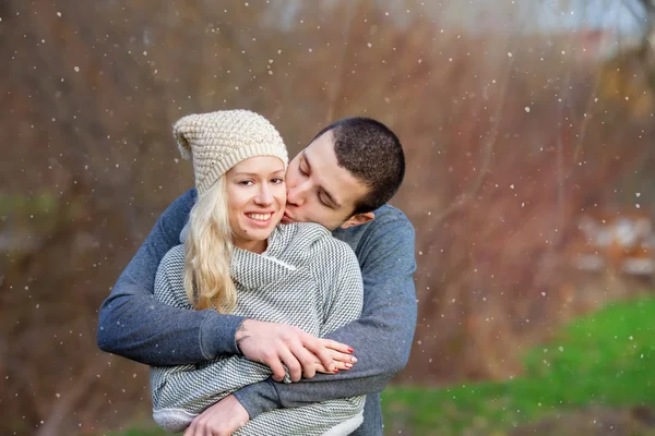 Young attractive couple in love, teenagers having fun outdoors, — Stock Photo, Image