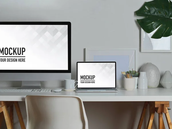 Modern workspace with mock up desktop computer and laptop on white table with office supplies, clipping path