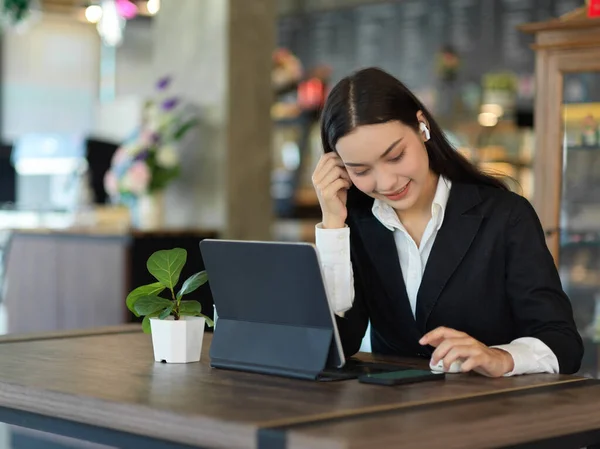 Top view of businessman hand working with tablet, smartphone and office supplies, include clipping path