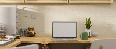 3D rendering, laptop with mock-up screen on wooden table with supplies and plant pot decorated in the room, 3D illustration