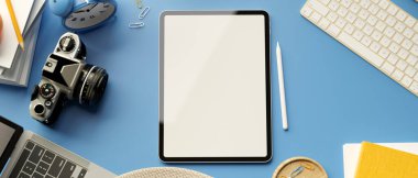 3D rendering, digital tablet with mock-up screen, camera, laptop and accessories on blue background, 3D illustration