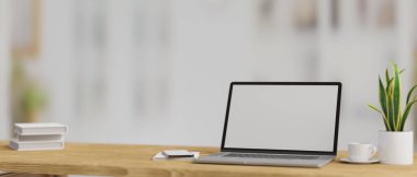 Computer laptop with mock-up screen on wooden table in blurred background, 3D rendering, 3D illustration