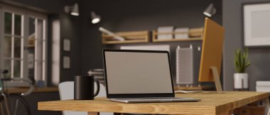 3D rendering, laptop with mock-up screen on wooden office table in contemporary office room, 3D illustration
