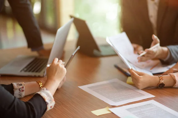 stock image Group of professional financial team working together, financial spreadsheets and laptop computer on table 