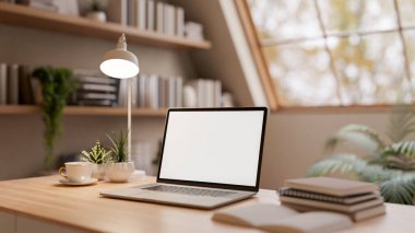 White screen laptop with coffee cup and books on wooden table in bright room under roof window. Working or Study corner, 3d rendering, 3d illustrations.