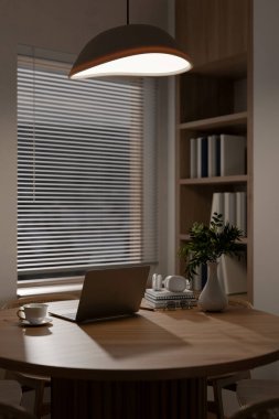 A laptop and coffee cup with glasses and headphones over book on round wooden table in dim library or study room. 3d rendering, 3d illustrations.