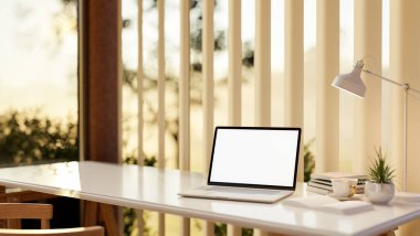 White screen laptop and tea cup on white table with chair next to glass wall and sheer curtain. Working or Study corner. 3D rendering, 3d illustration.
