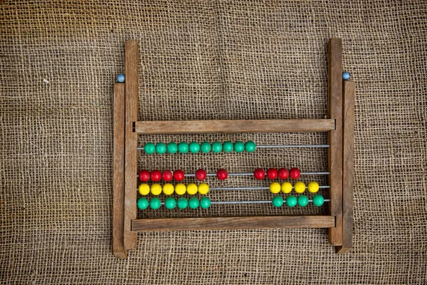 Abacus em fundo de textura natural — Fotografia de Stock