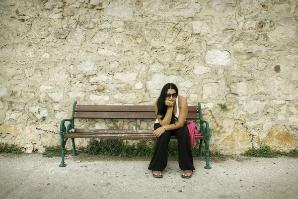 Dark Hair Woman is Thinking on Bench — Stock Photo, Image