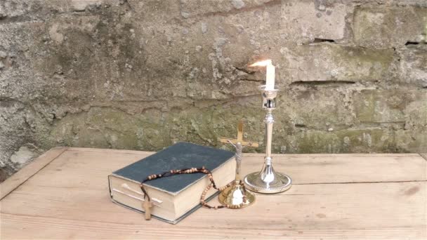 Bible with Candle  Light and Brick Wall — Stock Video