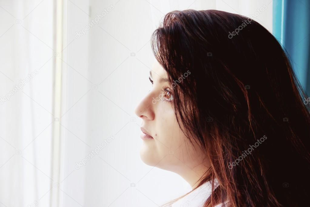 Woman Looking Out of Window