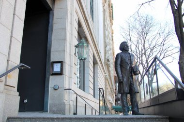 Frederick Douglass statue on the steps of New York Historical Society building, at the W 77th Street entrance, New York, NY, USA - March 13, 2021 clipart