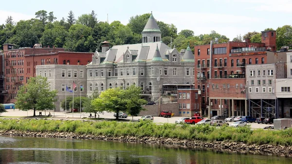 The Olde Federal Building, landmark edifice, waterfront view across the Kennebec River, Augusta, ME, USA - July 26, 2020