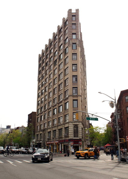 1929 multi-story residential Art Deco building at 2 Cornelia Street, mini-version of the Flat Iron, view from the 6th Avenue in West Village, New York, NY, USA - April 24, 2021