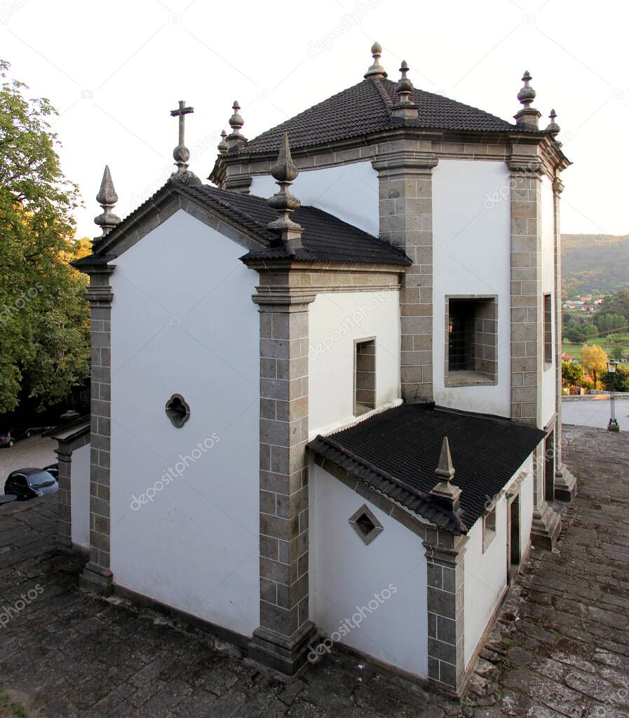 Chapel of Nosso Senhor do Horto, completed in Baroque style in 1758, rear side view in the early evening, Povoa de Lanhoso, Minho, Portugal - July 17, 2021