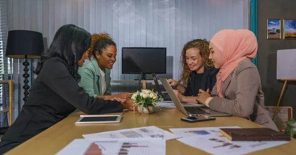 diverse businesswomen, caucasian, asian, african american, plus size, muslim teamwork having business meeting and presentation for women business activity in office selective focused
