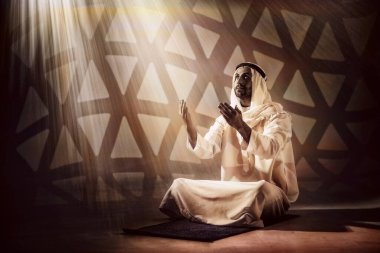 islam religion background of arab muslim man having worship and praying for god blessing during period of ramadan in hot tone clipart