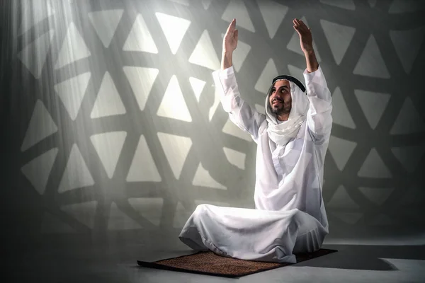 arab muslim prayer worship and praying for allah blessing in islamic mosque. arab muslim sitting and dua praying during holy month of ramadan