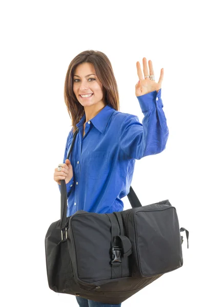 Pretty fashionable woman with large suitcase waving — Stock Photo, Image