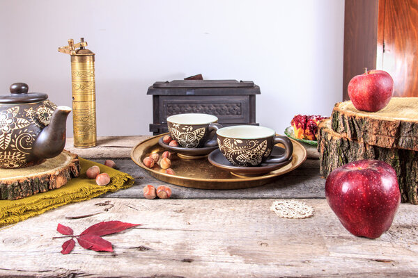 Cups of tea on old wooden table