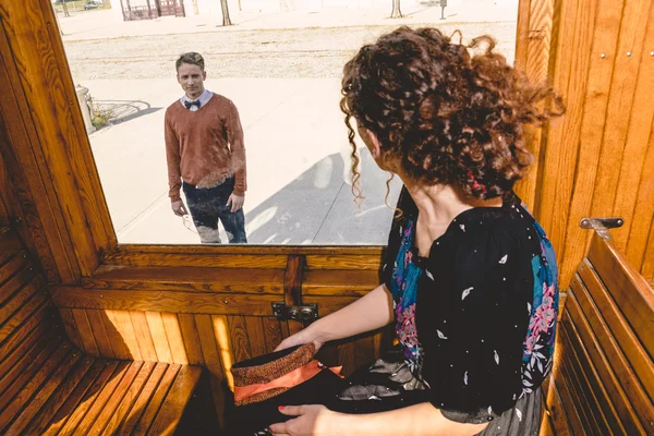 Young woman waving in the wagon train or tram ,  leave-taking — Stock Photo, Image