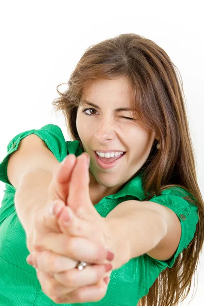 Girl in green shirt making gun gesture like handgun isolated on — Stock Photo, Image