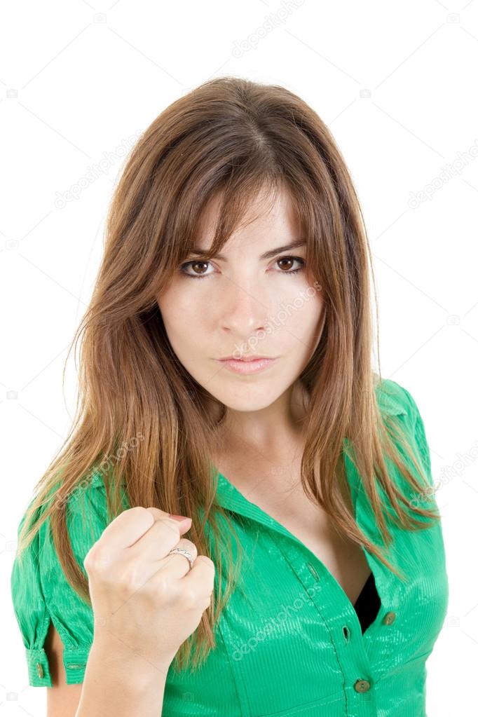  young angry brunette woman throwing punch with fist to camera