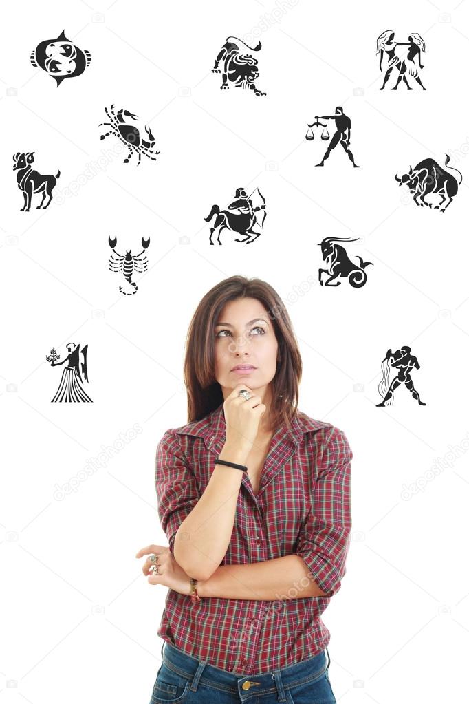 beautiful woman surrounded with zodiac signs thoughtfully lookin