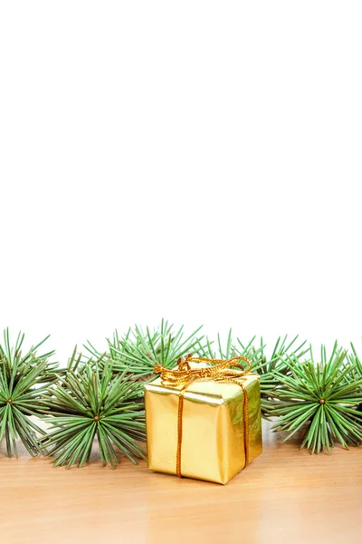 Wonderful Christmas decoration with fir tree and yellow gift or — Stock Photo, Image