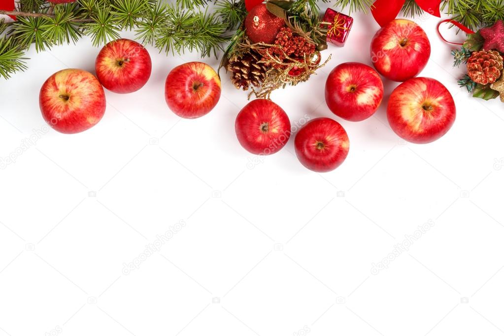 Christmas decoration with red apples and green fir tree