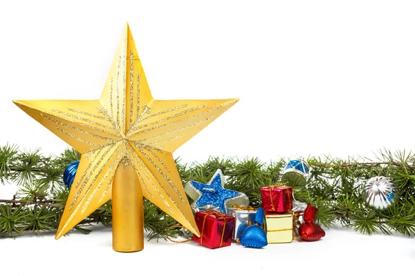 Decoration with green pine or fir and many gifts and gold star f — Stock Photo, Image